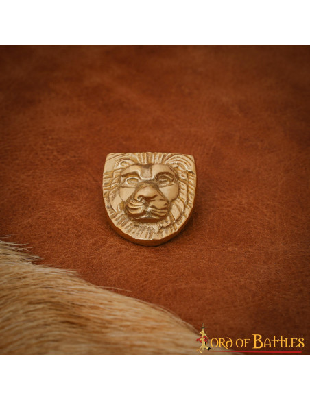 Messing blad versierd met leeuwenkop