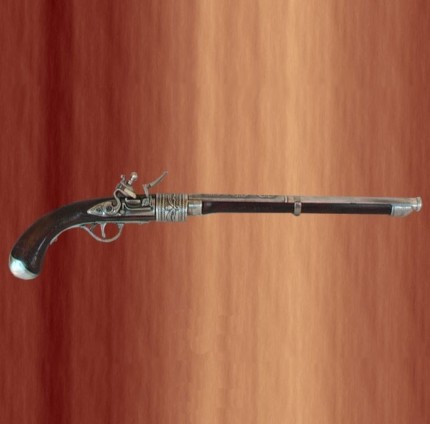 Pistola antigua de cañón largo